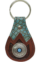 8167068T - Keychain - Embossed overlay on Genuine Italian leather, round concho with a TQ center